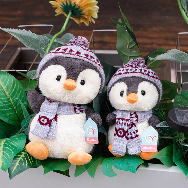 Bonitos pingüinos juguetes de peluche bufandas de invierno muñecas de dibujos animados niños mochilas agarrar muñecas al por mayor muñecas noreste