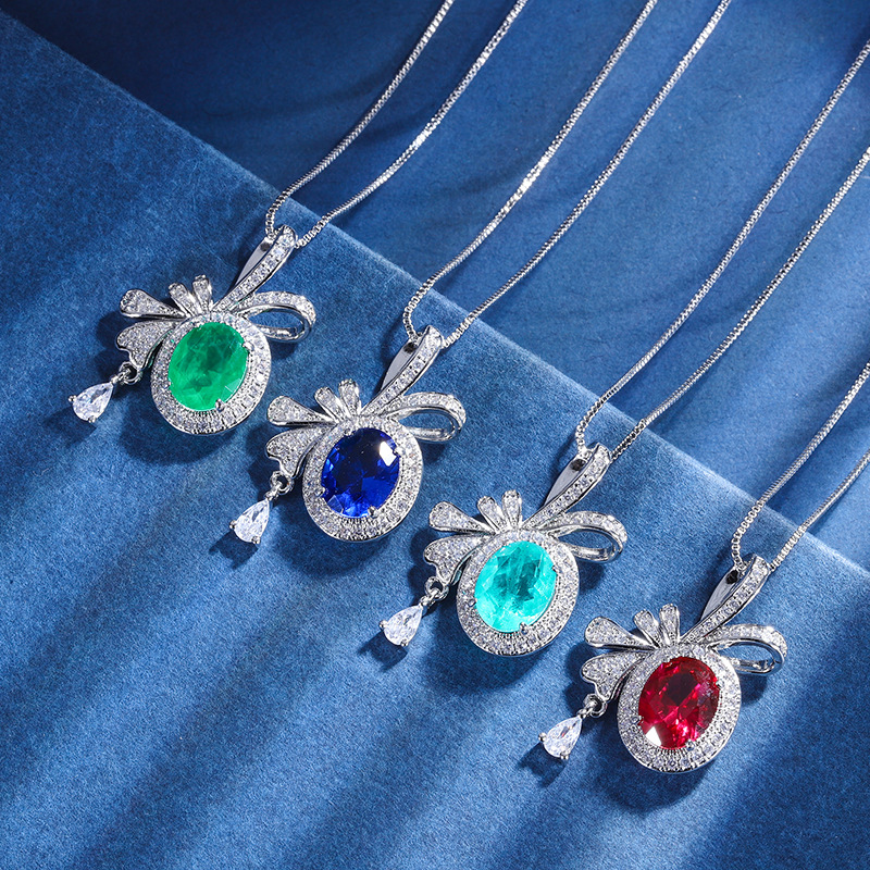 Zhuang Sheng joyas cobre inferior chapado en oro Nueva simulación color tesoro arco creativo colgante collar diamante incrustado piedra principal 8 *