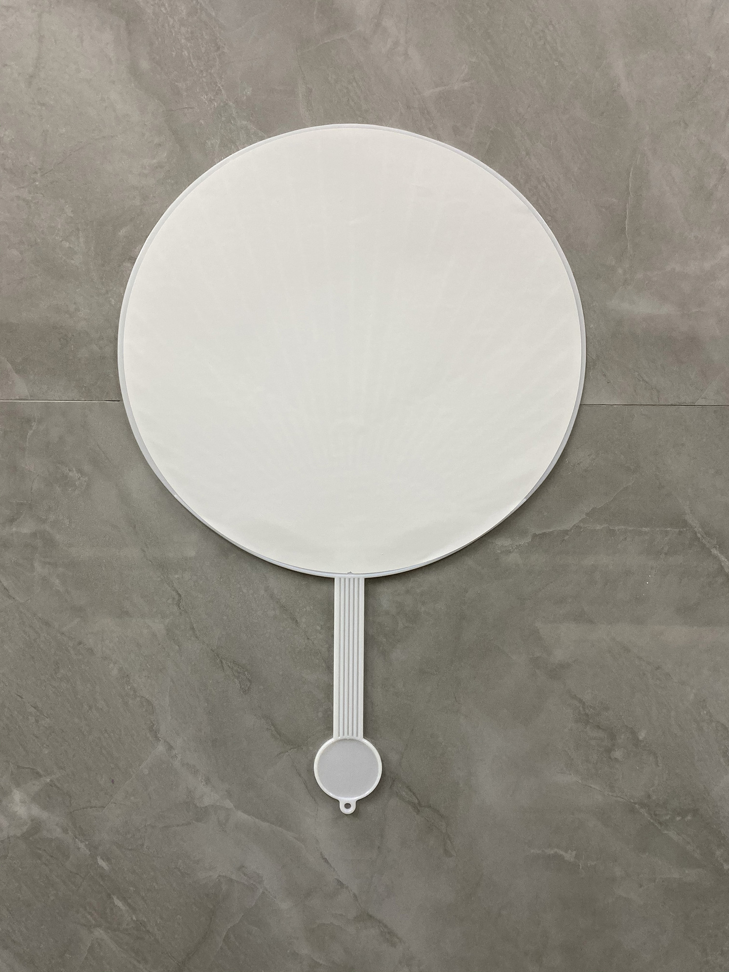 Big round fan with white surface