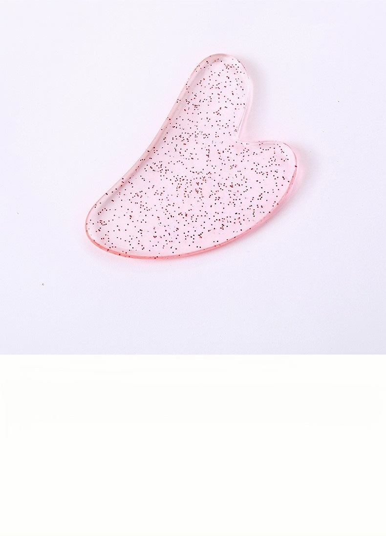 Heart Shaped Gua Sha Facial Massage Tool Resin Scraping Board for Face and Body Care in use