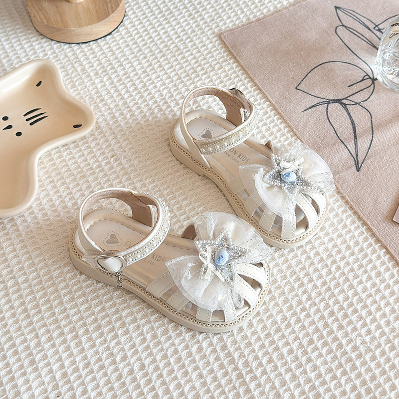 Niñas sandalias Baotou 2026 verano nuevo estilo de moda infantil sandalias versátiles diamante estrella malla princesa zapatos de moda