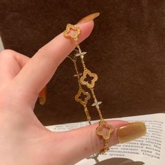 S925純銀の透かし彫りの四つ葉のクローバーのクロスジルコンのブレスレット