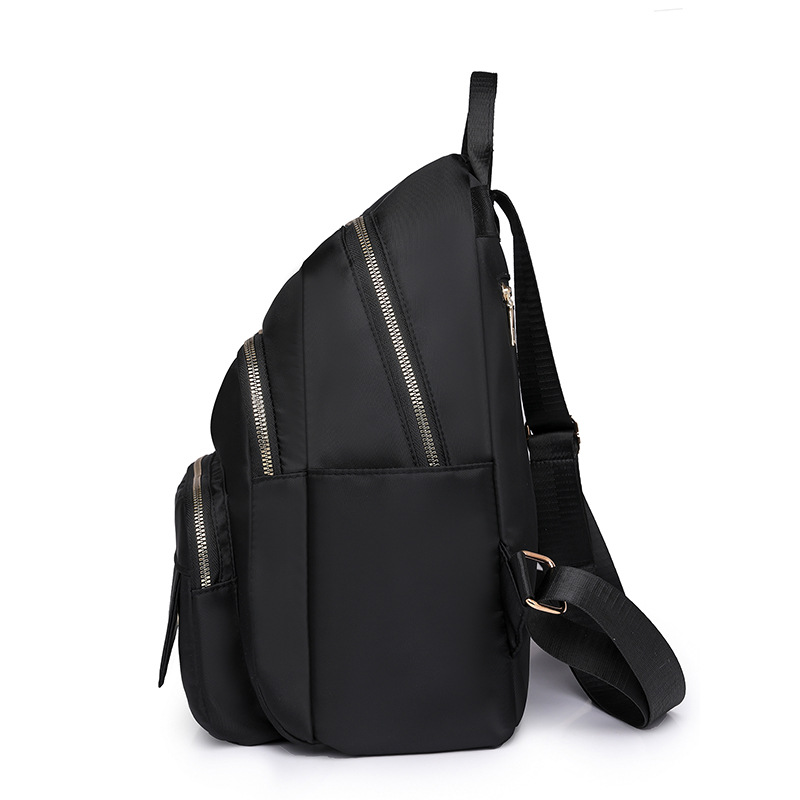 2024 nueva mochila casual de nailon de color sólido para mujer, mochila de viaje de gran capacidad para viajes al aire libre simple y de moda