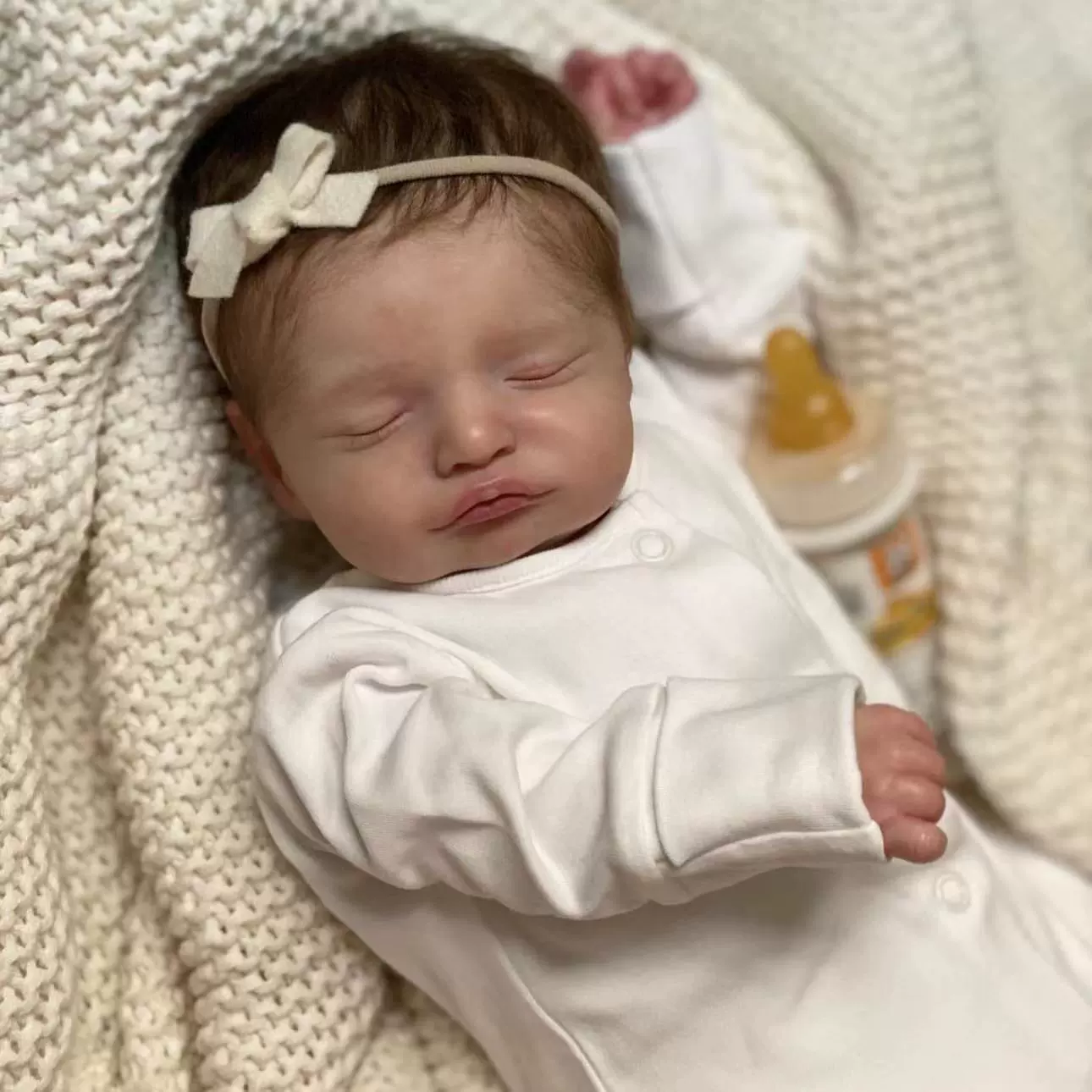 Реалистичная кукла reborn Cokela Rasalie, 49 см, тканевое тело, вшитые коричневые волосы