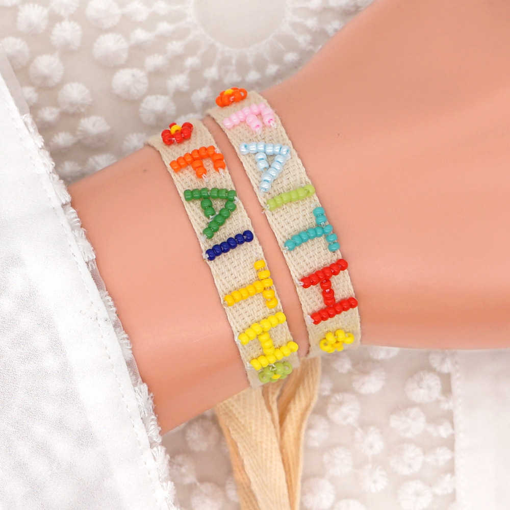 Bohemian Ribbon Rice Bead Woven Rainbow Letter Bracelet display picture 58