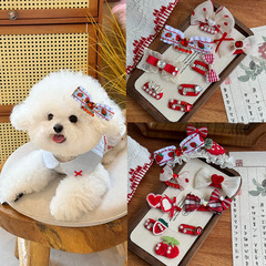 犬のヘアピンの蝶結びは熊の髪より新年の赤いお祝いの古風ペットの頭飾りの猫のマルジスです。