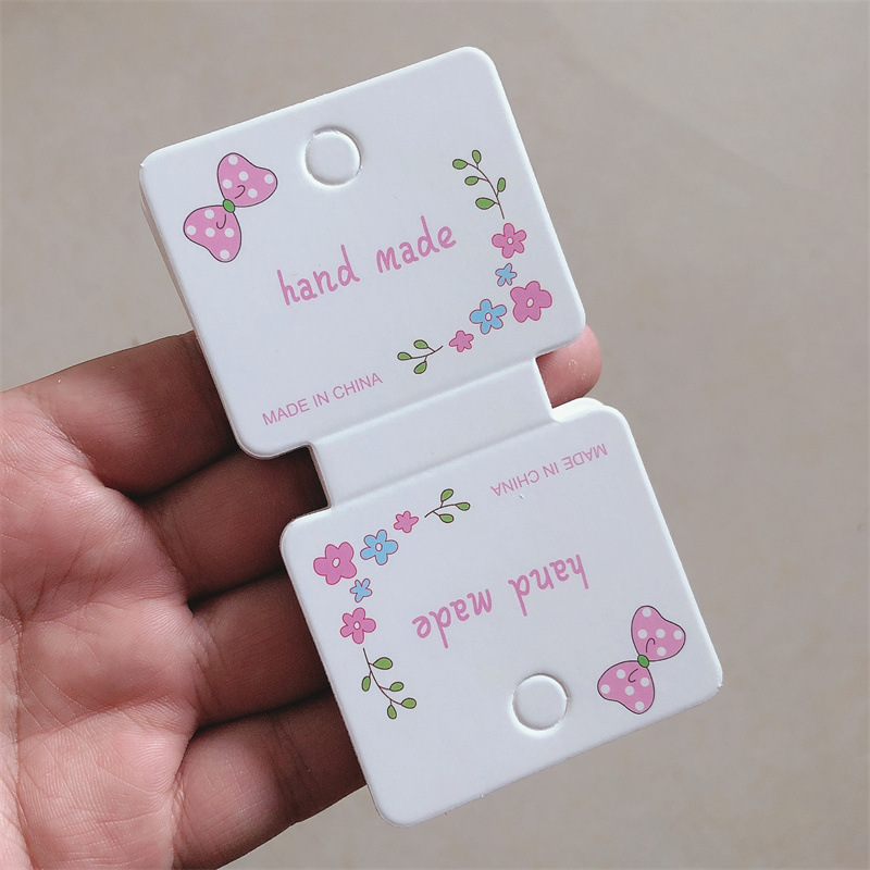 【100张】5.5*10厘米 粉色蝴蝶结对折发夹卡纸发饰包装卡片吊牌