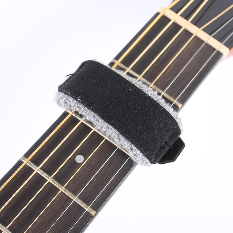 Venta al por mayor eliminación de ruido detener la guitarra silenciador banda de guitarra stuffy banda Folk madera guitarra eléctrica haz banda de sonido
