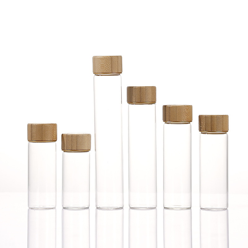 Botella de reactivo de la píldora de muestra de tapa de madera de bambú al por mayor, botella de embalaje de azafrán de boca de tornillo, botella de control de borosilicato de 30mm de diámetro