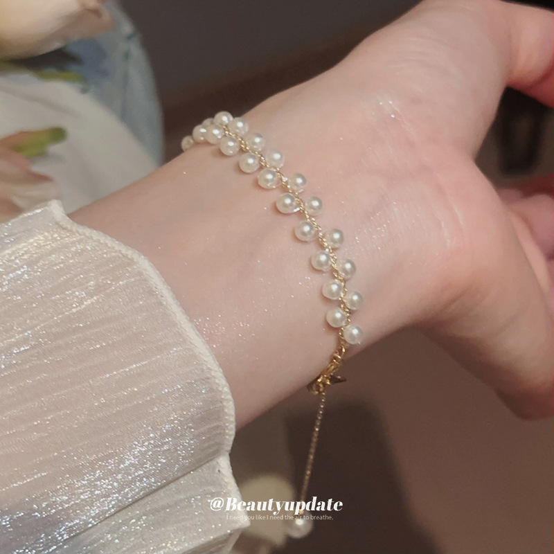 Pulsera tejida de perlas de doble hilera francesa, lujo ligero, pulsera exquisita de moda de alta gama, nueva joyería de todo fósforo, venta al por mayor femenina