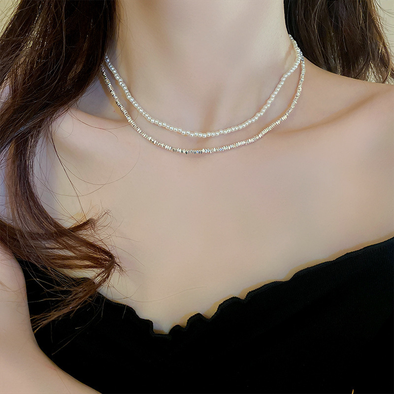 Collar de perlas con lazo de súper hada, cadena de clavícula de moda de lujo ligero francés, sentido de alta gama, joyería de nicho de arte, mujer al por mayor