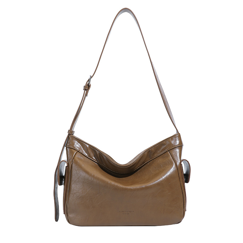 Retro perezoso estilo de viaje bolsas debajo de las axilas para mujeres otoño y invierno 2025 nuevo hombro ancho bolso de hombro nicho textura mochila