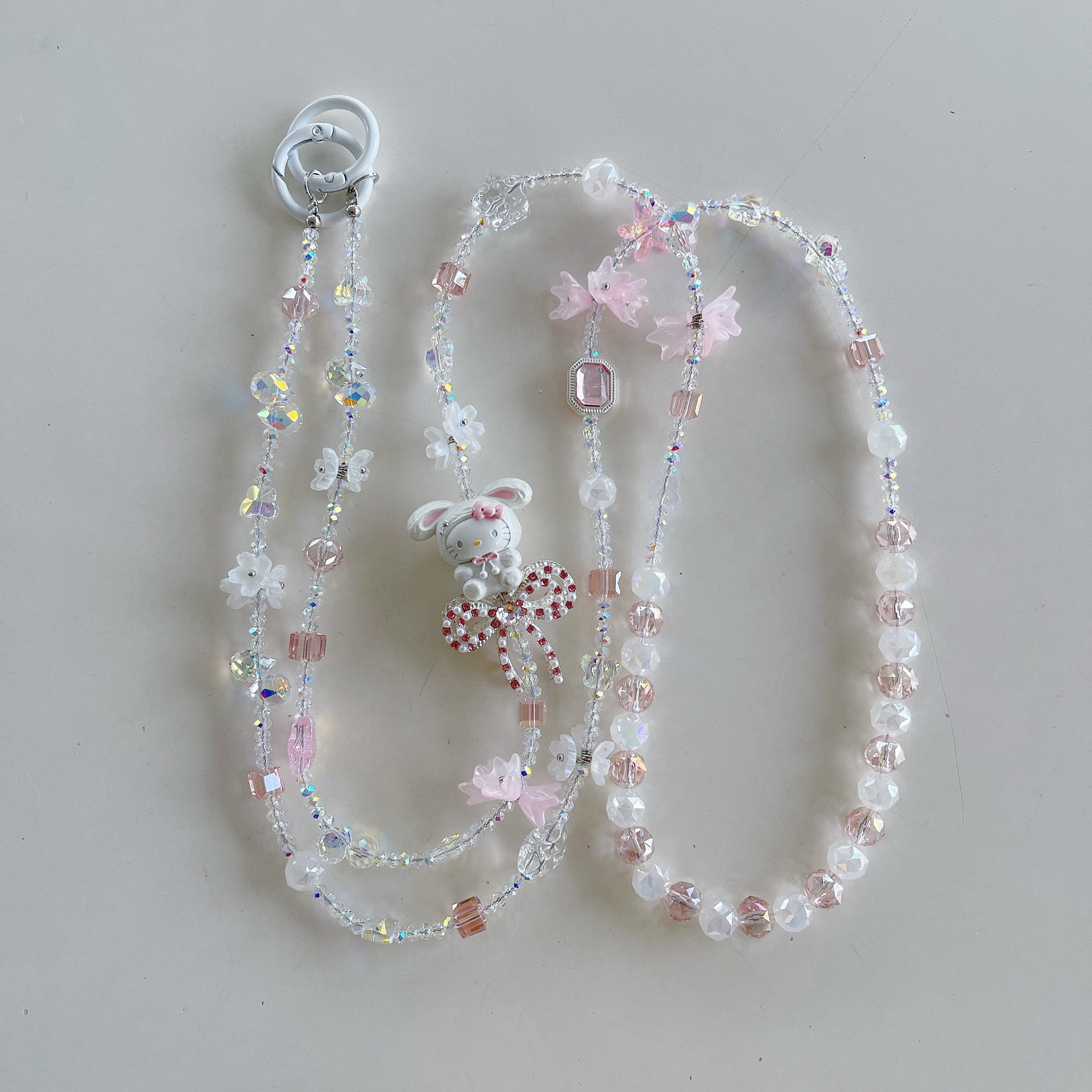 Boutique hecho a mano de alta gama para teléfono móvil cadena larga de gato KT lindo femenino cordón de teléfono móvil de moda colgante de mensajero largo