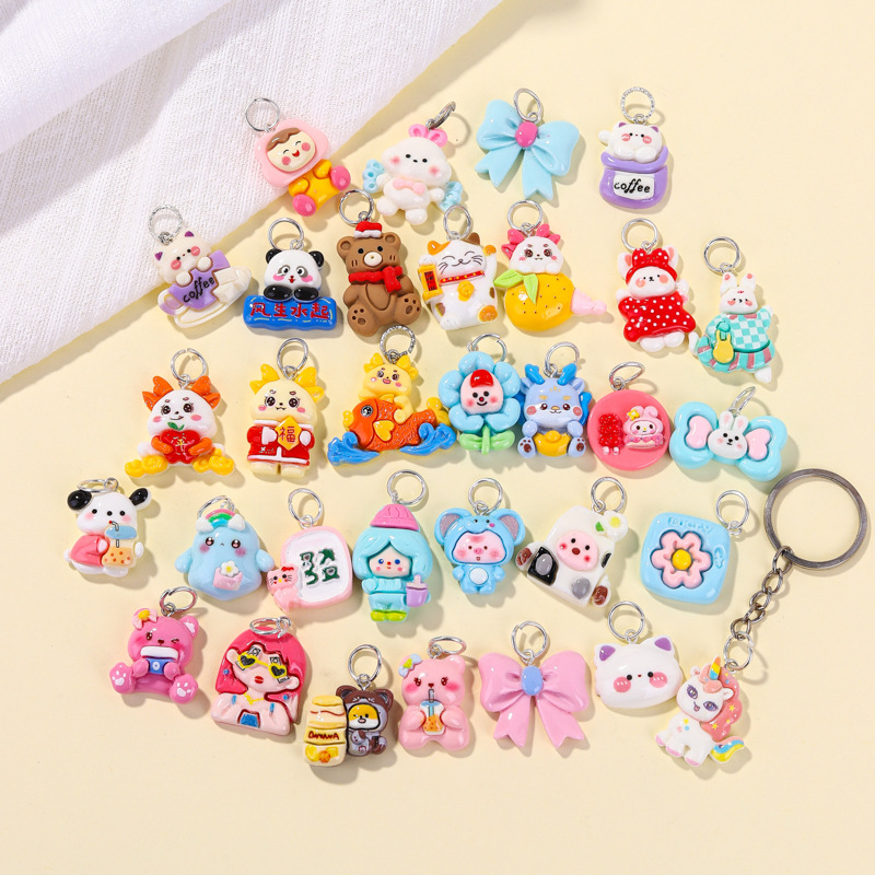 Llavero de material de resina de dibujos animados al por mayor, accesorios lindos, colocación creativa, colgante de bolsa portátil