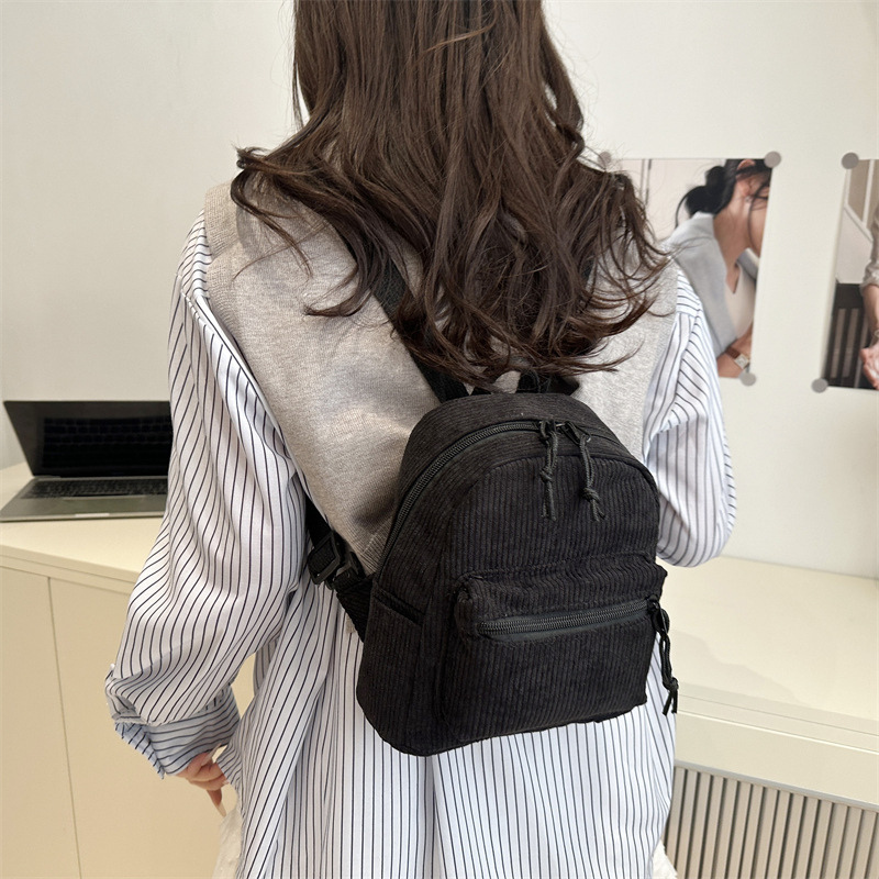 2025 nueva mochila casual japonesa tendencia universal mochila de moda simple nicho bolso portátil ligero