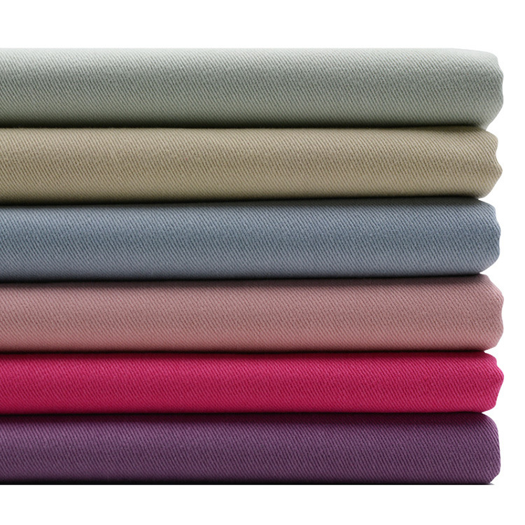 Lote de stock 285gsm 100 material de tela de algodón tejido teñido de sarga