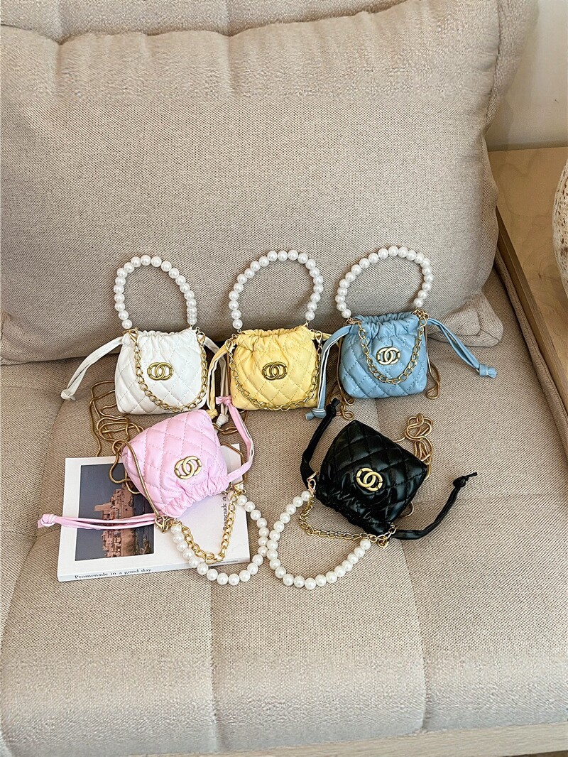 2026 nuevo niño cadena de perlas bolsos de diamante chicas moda mini bolsos de hombro caramelo princesa mochila