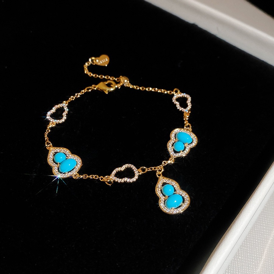43 pulseras - doradas - azules