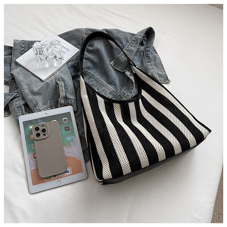 Korean summer new striped woven bag, casual vacation and laid-back style tote bag, hand and shoulder commuter tote bag undefined
