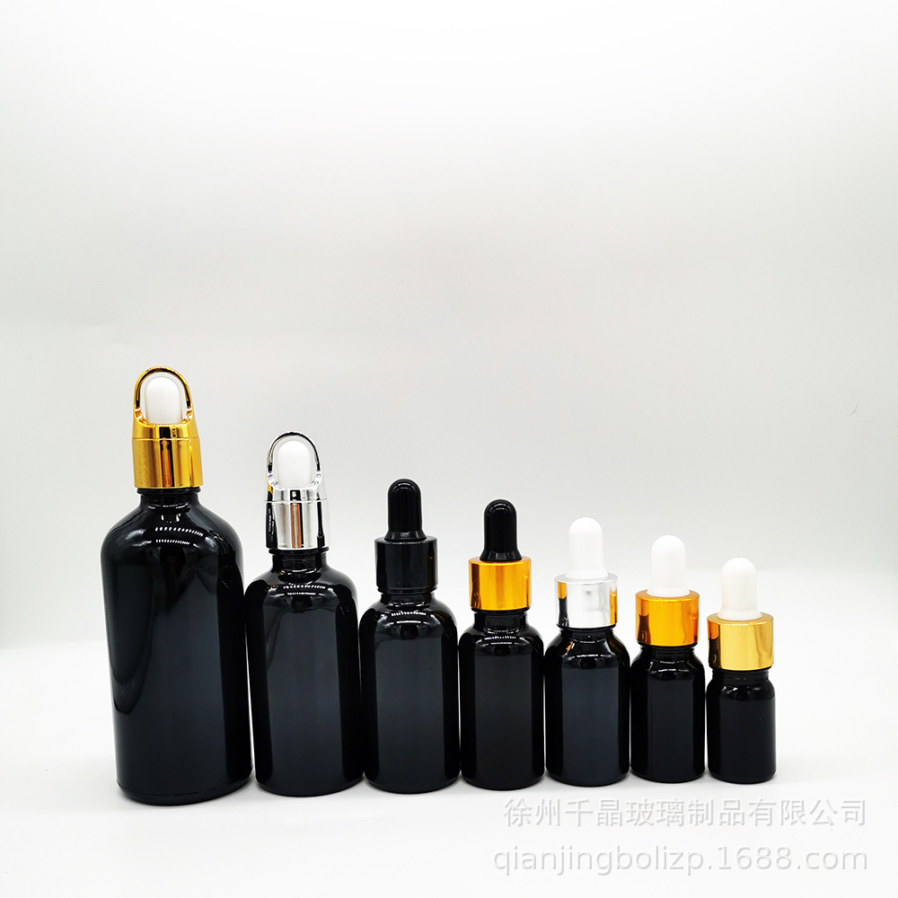 En stock botella de aceite esencial de vidrio negro brillante 5mL-100mL materia prima cosméticos negros sub-botella sombreado botella cuentagotas de cabeza de goma