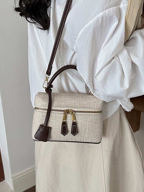Bolso de mano de alta sensación para mujeres 2026 nuevo nicho zhong lino bolsa de almuerzo de viaje transfronterizo mochila pequeña bolsa