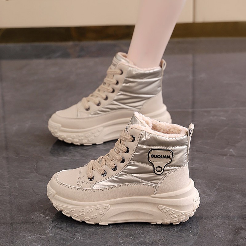 Botas de nieve de invierno de mujeres 2025, una nueva piel en una calentadora zapatillas deportivas cómodas y zapatos de algodón gruesos para mujeres