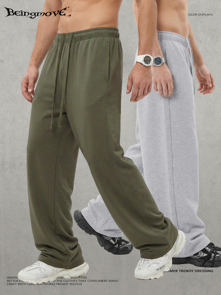 Calle seca nueva tela de capa de aire transpirable color sólido pantalones rectos cuerdas sueltos pantalones deportivos casuales para hombres