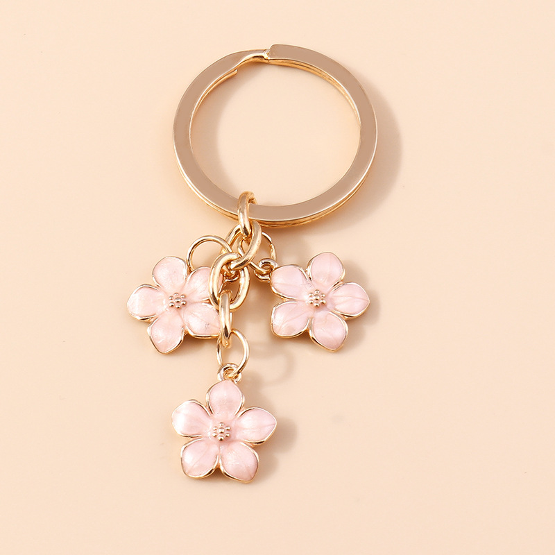 Dulce chica corazón flor de cerezo llavero simple Flor del ciruelo flor teléfono móvil bolso colgante decorativo joyería