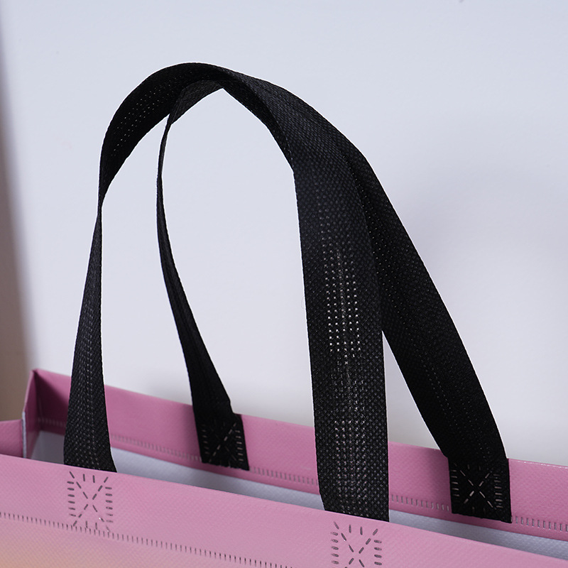 Bolsas de tela no tejida con película láser de tres colores de alta calidad, bolsas para hombres y mujeres de alto valor, grosor personalizado LOGO