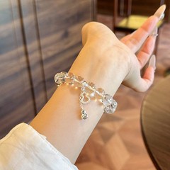 スターの同じタイプは天然の白い水晶のブレスレットの女性の透明な玉をまねて水晶のヒョウタンの手を運んで連発して親友の贈り物を送ります。