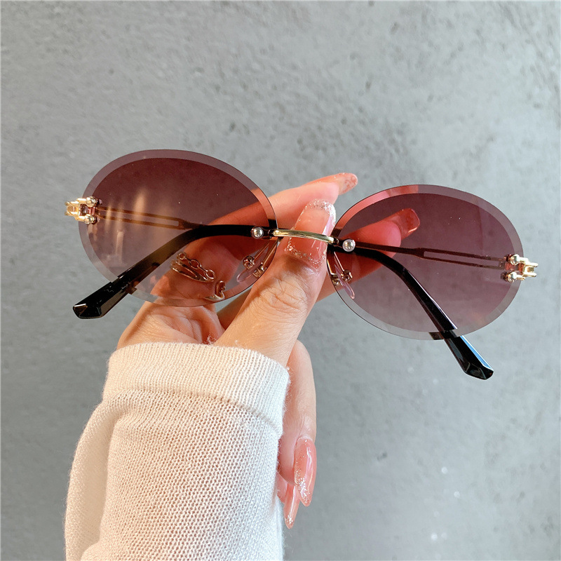 New Sunglasses Women's Oval Gradient Sunglasses Frameless Cutting Edge Trendy Glasses_voghion.com