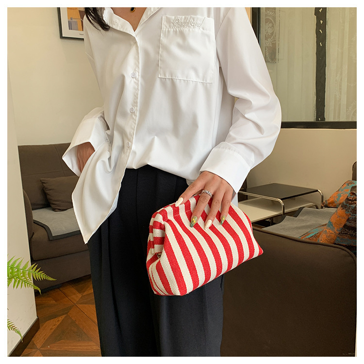 New cross-border fashion color-blocking striped cosmetic bag, women's loose change mobile phone storage bag, trendy and niche cloud clutch undefined