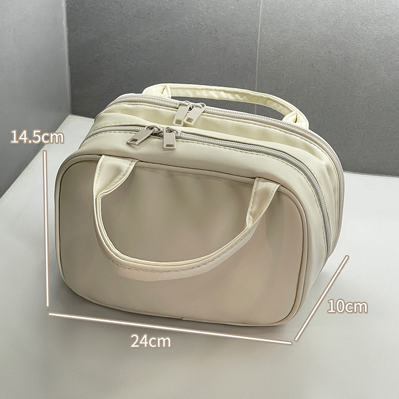 2024 nueva bolsa de maquillaje portátil PU de viaje portátil bolsa de almacenamiento de doble capa de gran capacidad bolsa de alta calidad