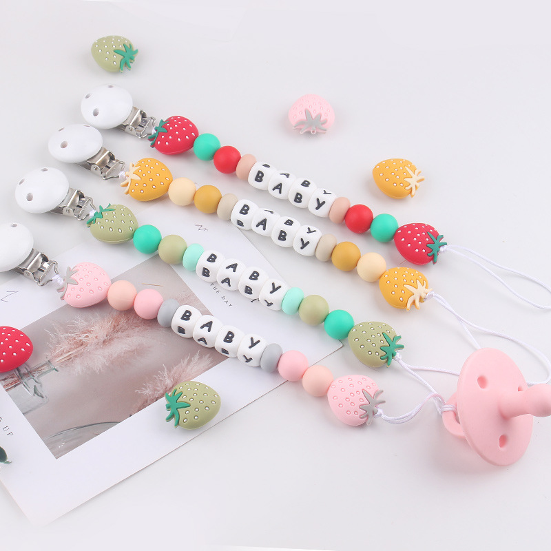 Nuevos productos para bebés Clip de chupete redondo de madera para calmar la cadena de chupete de silicona de fresa de dibujos animados para bebés