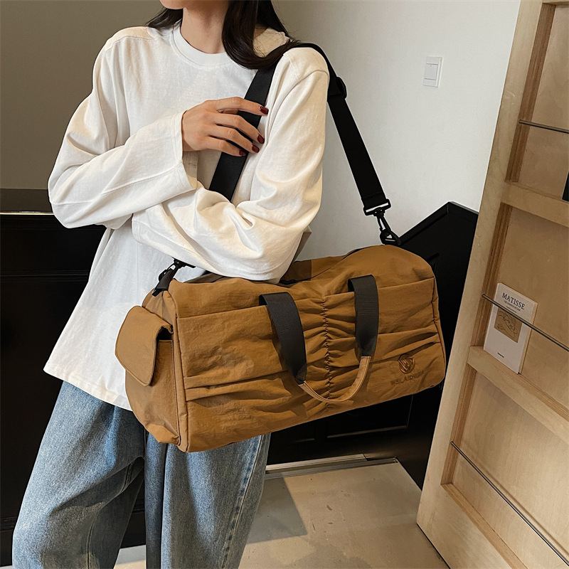 Bolso deportivo coreano transfronterizo femenino 2025 nueva bolsa de almacenamiento separada seca y húmeda bolsa de viaje de viaje