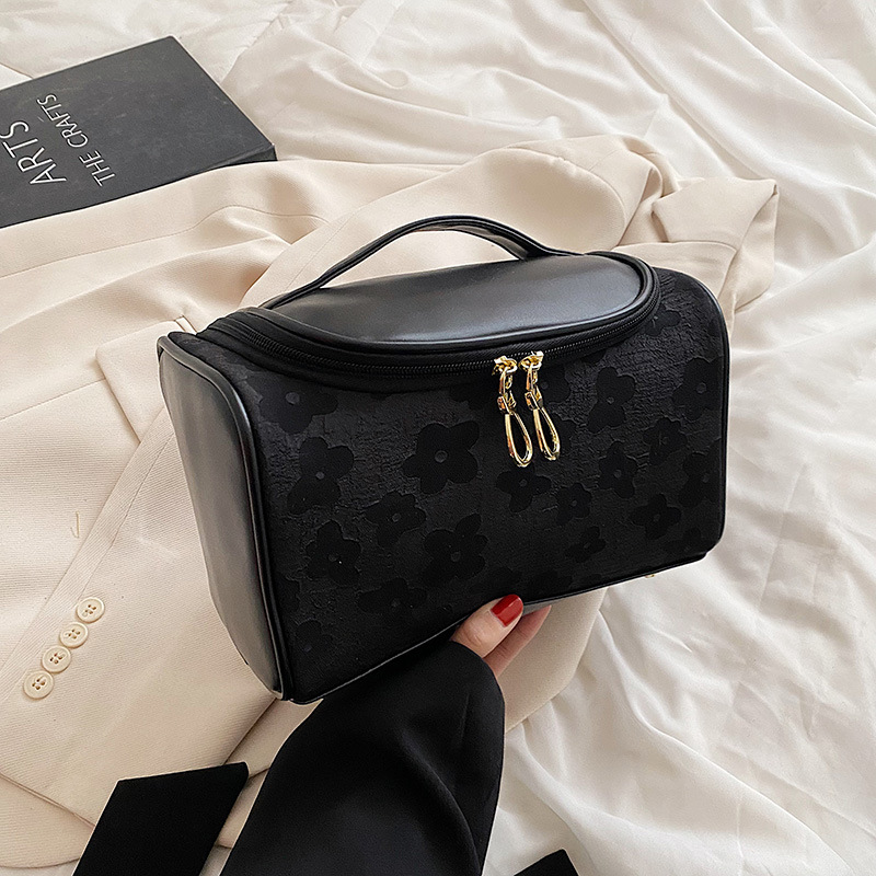 Handheld cosmetic bag for traveling