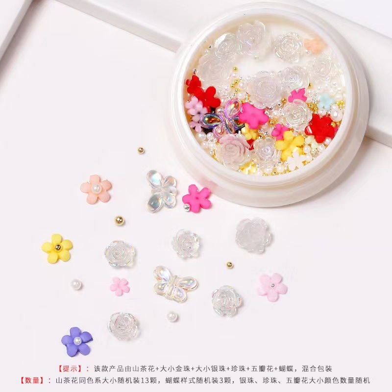 Nueva celebridad en línea suministros de uñas 3D multicolor de alto grado Camelia mariposa cinco pétalos flor bola de acero joyería de uñas diamante