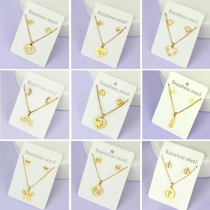 Net Red Butterfly Love Cross Personalidad Simple Juego de joyas de acero inoxidable Pendientes de oro Juego de collar al por mayor