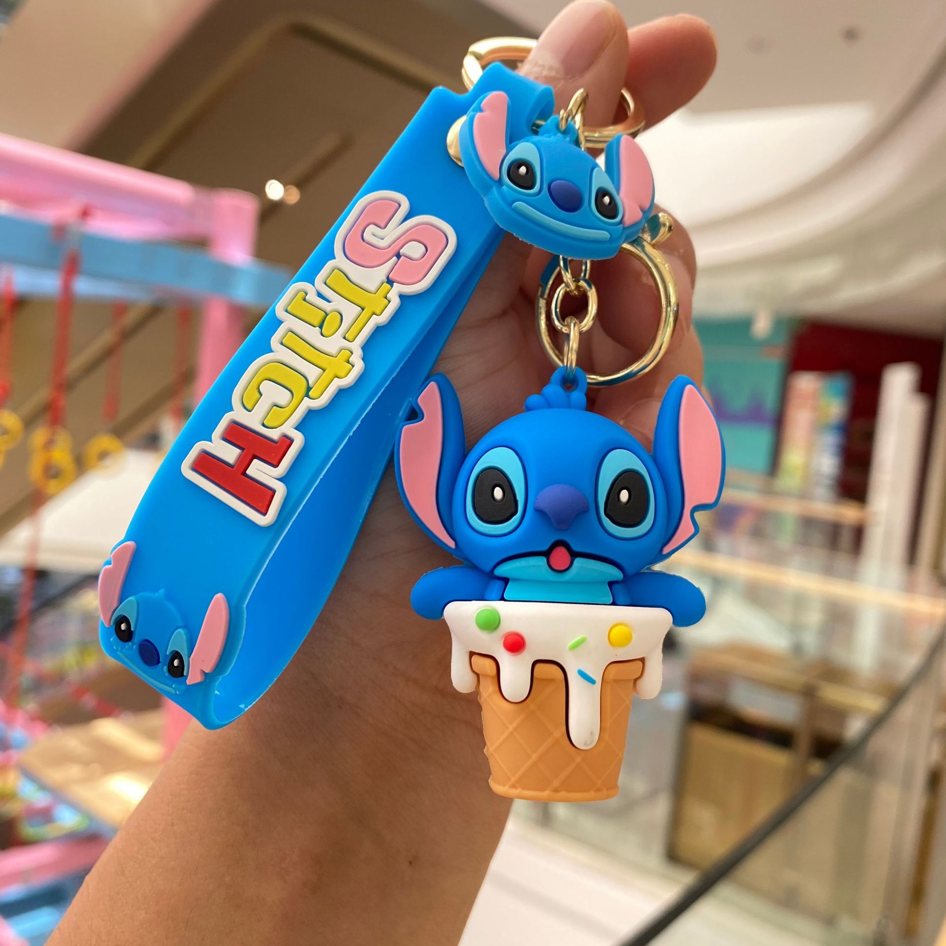 Dibujos Animados transfronterizos codiciosos puntada llavero colgante bolsa coche llavero muñeca rascando máquina regalo al por mayor