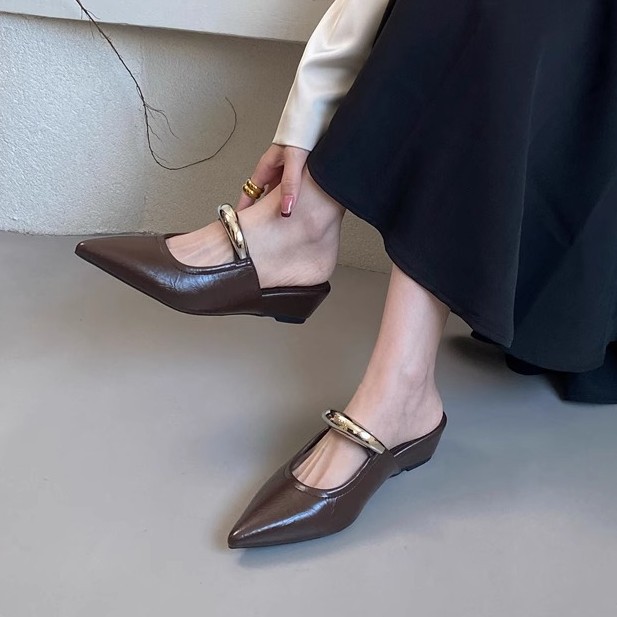 Elegant fashionable women's slippers with a strap pointed-toe wedge…