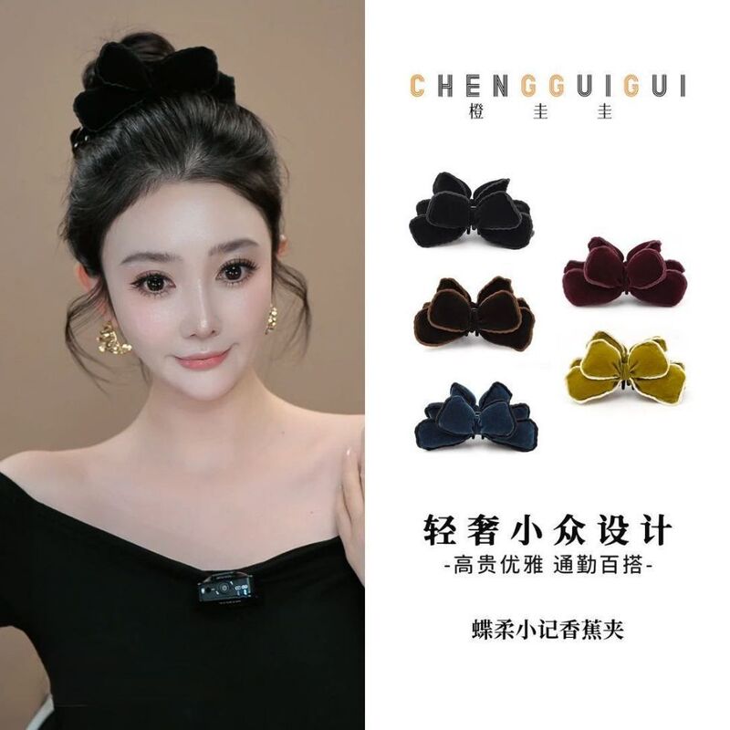Orange Gui Gui [Yunrou] Banana Clip, a stylish and versatile hair accessory with a butterfly design, perfect for creating a trendy and unique look