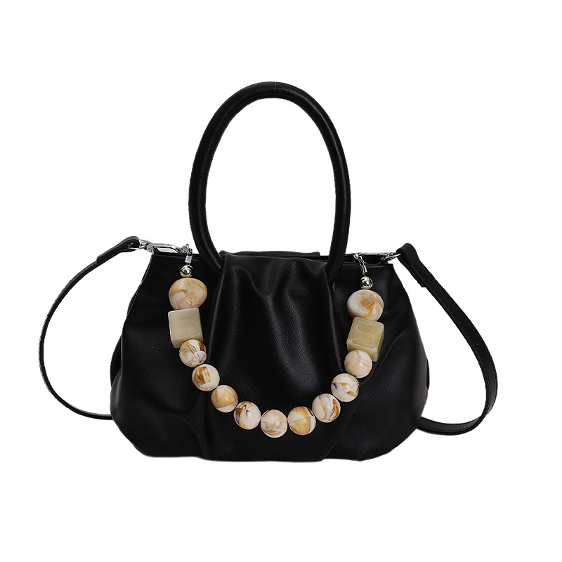 Alta sensación de mano pliegueada nube bolso de cubo para mujeres 2026 nuevo nicho de lujo ligero de moda perla bolsa de mochila