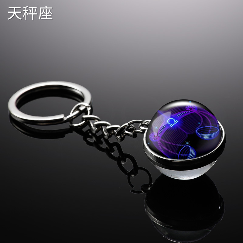 Transfronterizo 12 constelaciones de luz nocturna bolsos colgantes de bolsas de joyas de tiempo doble cara bola de vidrio llavero al por mayor
