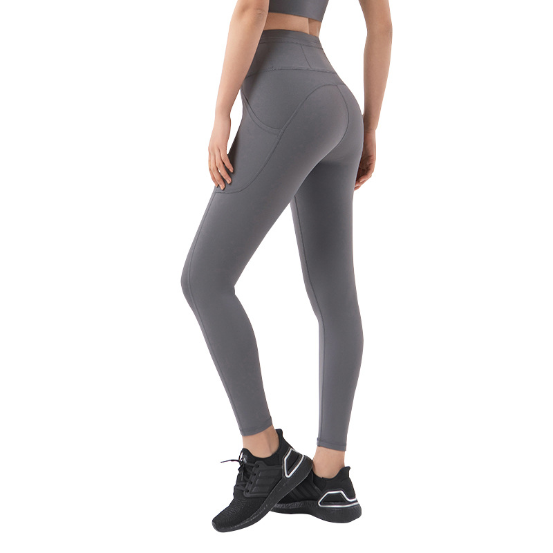 2022 bolsillo lateral desnudo apretado yoga pantalones de las mujeres de Europa y América cintura alta cadera elevación melocotón cadera deportes fitness Pantalones