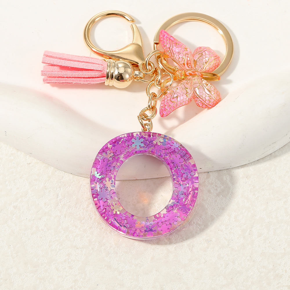 Nuevo color púrpura claro mezcla de polvo brillante letras inglesas resina llave colgante estilo simple mariposa borda colgante