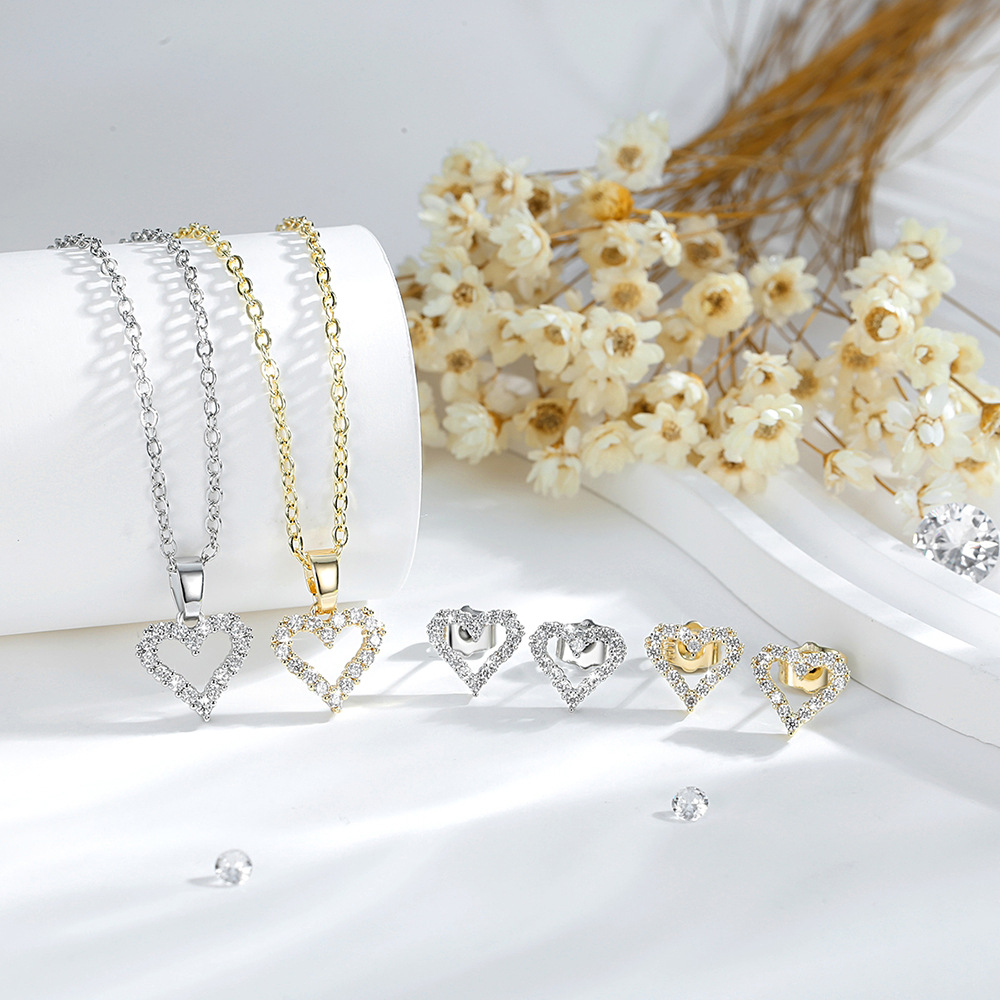 Ventas transfronterizas calientes de cobre 14K oro color amor collar pendientes de zircón corazón europeo y americano colgante conjunto de joyas mujeres