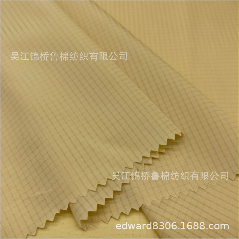 全涤格子提花四面弹力条子泡泡布洞洞布黑白色织朝阳千鸟格子印花