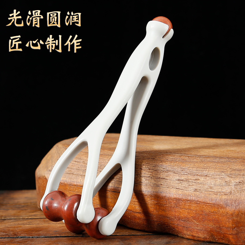 赤い石のマッサージ器の指のマッサージ器は板をかすめて神器をかすめ取ります。|undefined