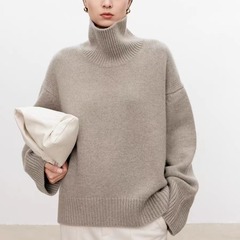 ヨーロッパの商品の大きいサイズの秋冬のウールのセーターの女性の高襟のカバーの頭の厚い郭の形のカシミヤのセーターの女性はゆったりしていて怠惰な風の中で掛けます。