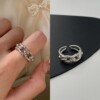 Line minimalistic fashionable brand ring, silver 925 sample, on index finger